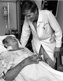 Dr. William DeVries and Barney Clark, first patient to receive a permanent total artificial heart, 1982